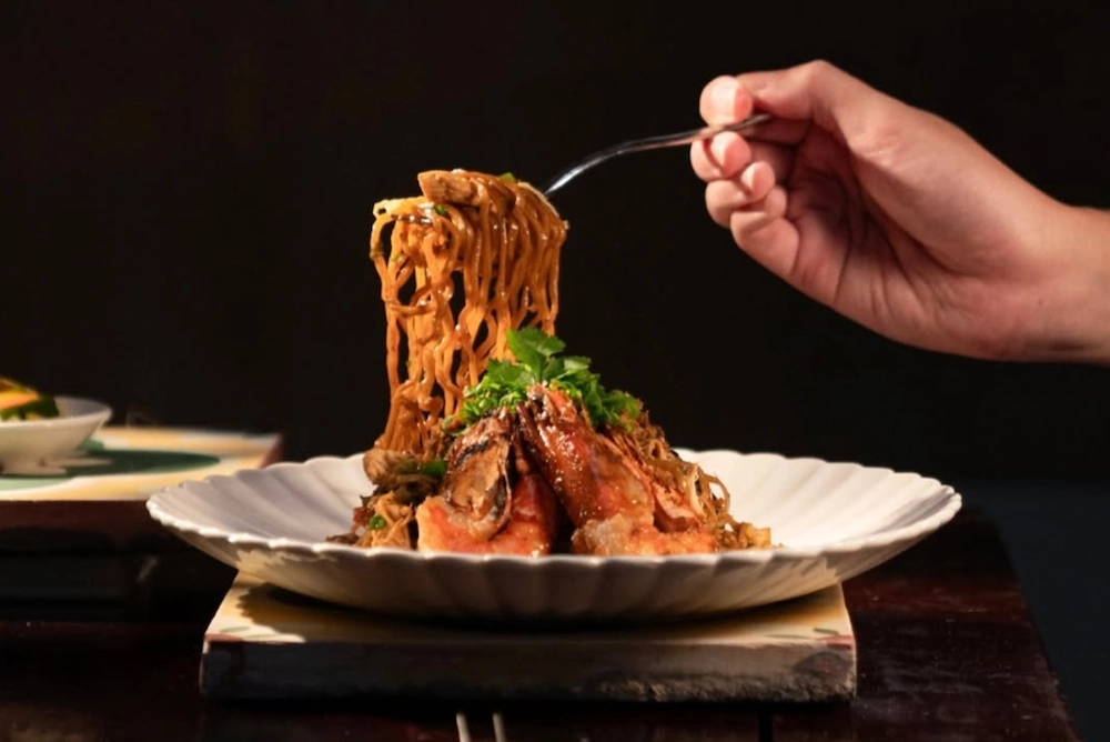 hand pulled pasta with fork