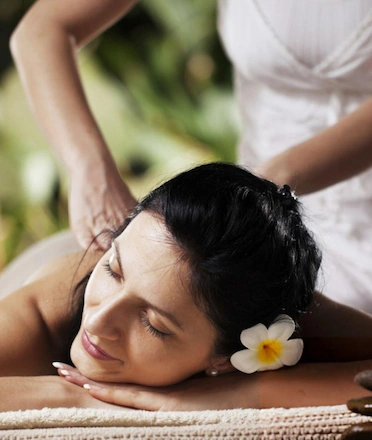 Woman Getting Luxury Spa Massage in Lush Nature Surroundings