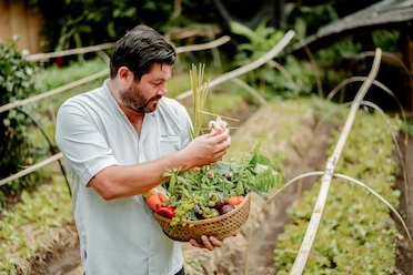 blake a guy in garden picking up spice