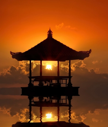 A small beach pavilion in Sanur, Bali during sunset A small beach pavilion in Sanur, Bali during sunset