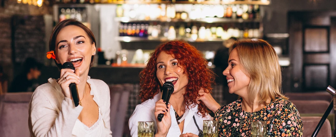 Women Enjoying Karaoke in a Bar