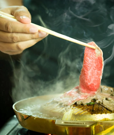Man Cooking Korean Style BBQ