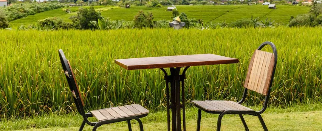 Restaurant Table and Seat overlooking lush paddy field