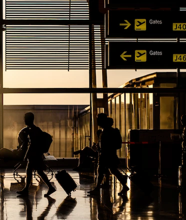 People Walking in Airport Terminal People Walking in Airport Terminal