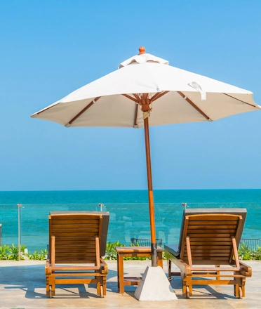 Cozy Restaurant Seating With Umbrella and Ocean View