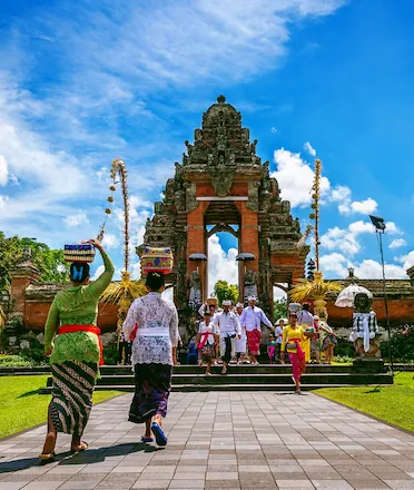 Balinese Gathering for Ceremony Under Clear Sky
