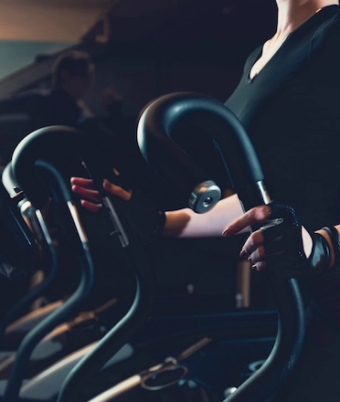Women in Gym Doing Cardio