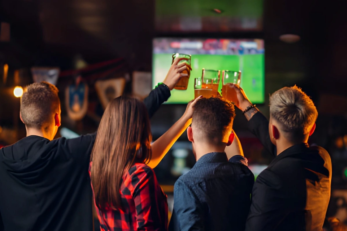 People Toasting at Sports Bar