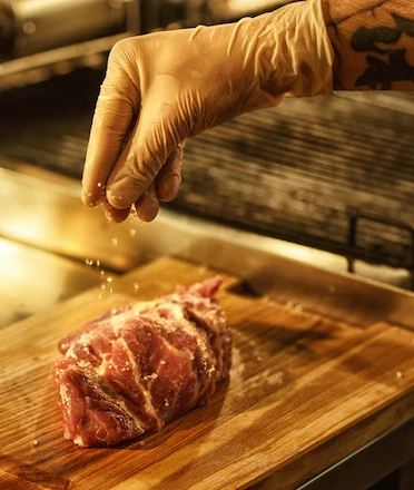 Chef Preparing Prime Meat for Steak Cooking