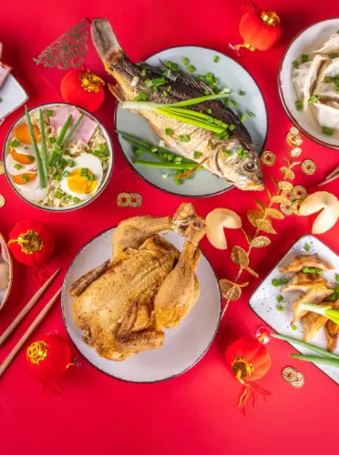 Festive Chinese New Year dining table filled with traditional dishes
