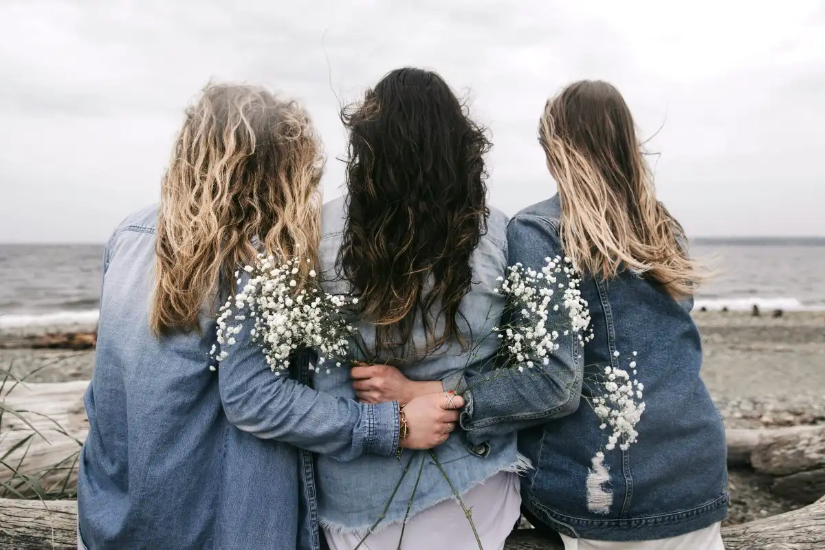 3 women holding together