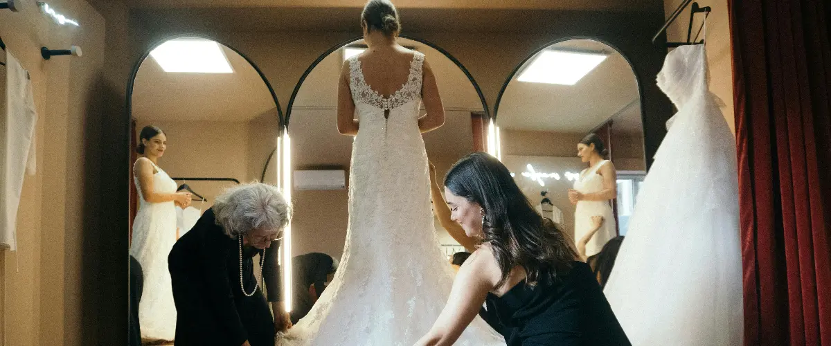 Bride trying on a wedding dress in a bridal boutique