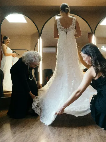 Bride trying on a wedding dress in a bridal boutique