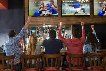 excited group of people watching soccer