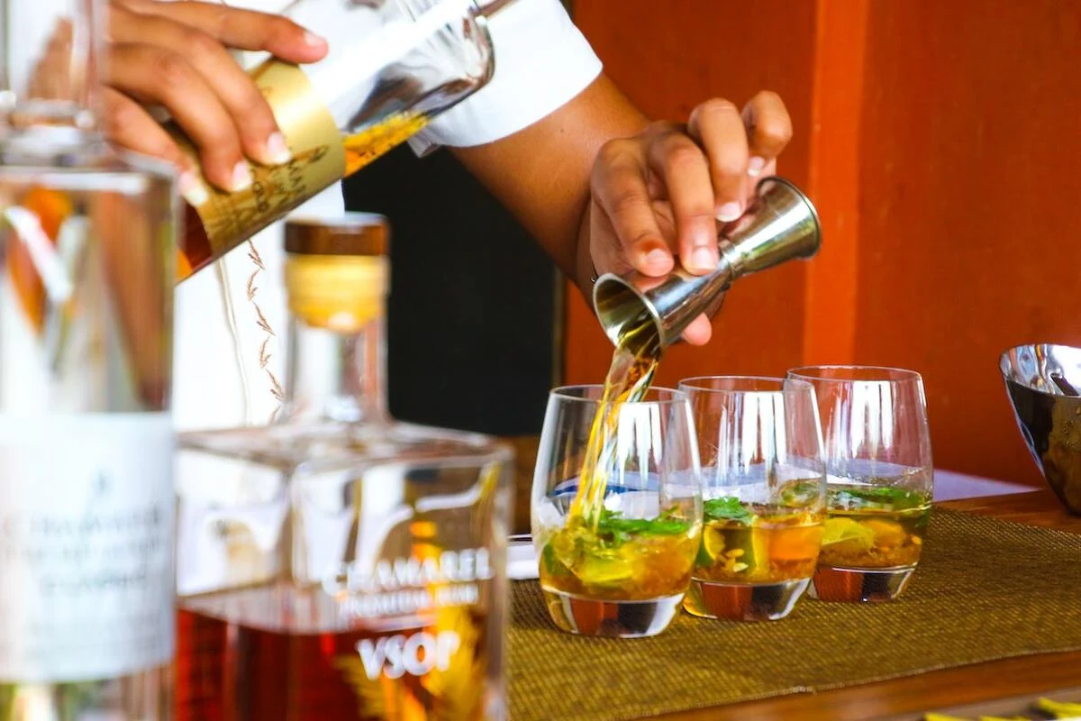 bartender preparing glass of cocktails