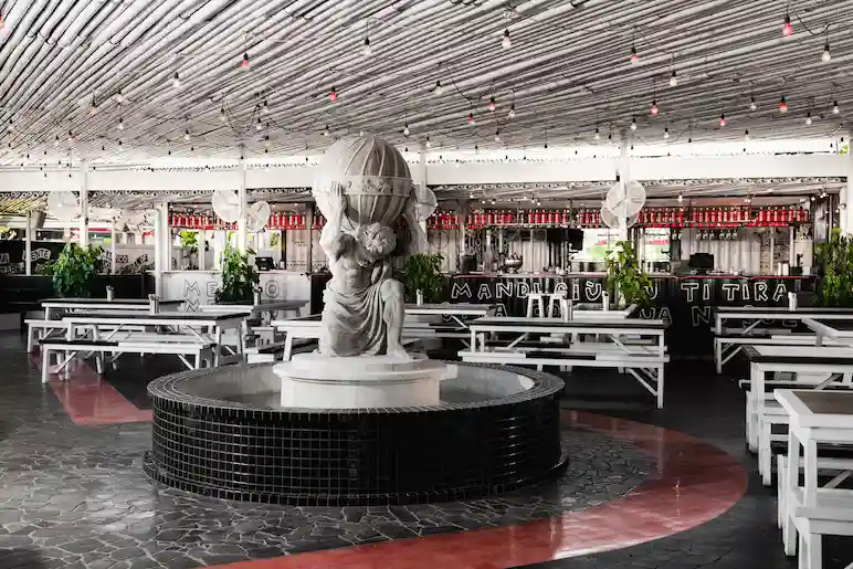 a statue carry a globe