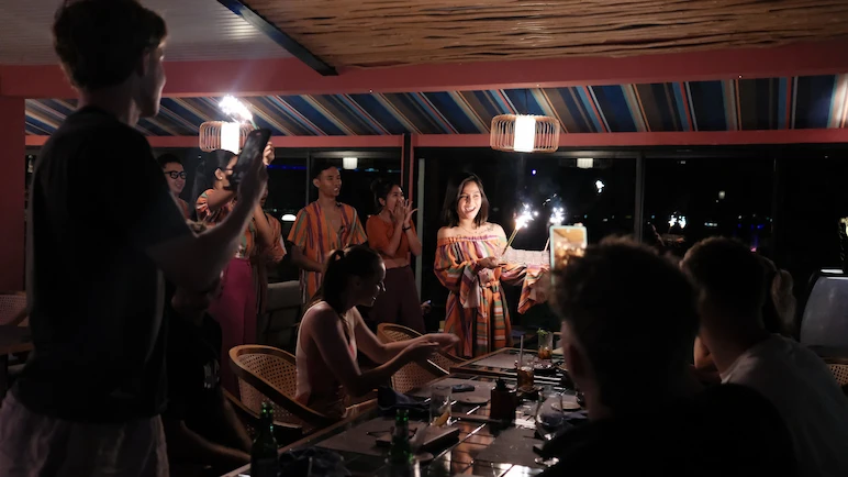 A group of people celebrate birthday