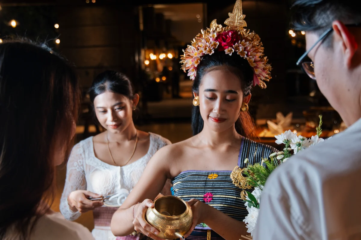 Balinese dancer pour the holy water