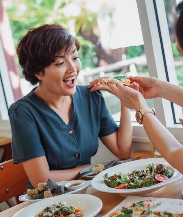 Two_women_eating_food
