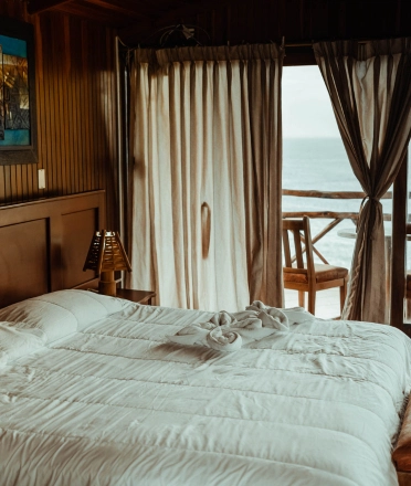 a_bedroom_with_an_ocean_view
