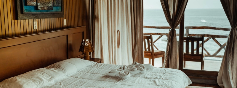 a_bedroom_with_an_ocean_view