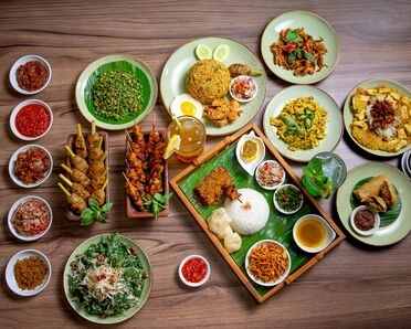 Indonesian dishes including satay, nasi campur, and variety of sambal