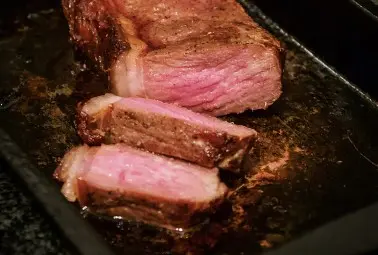 medium rare steak on the skillet
