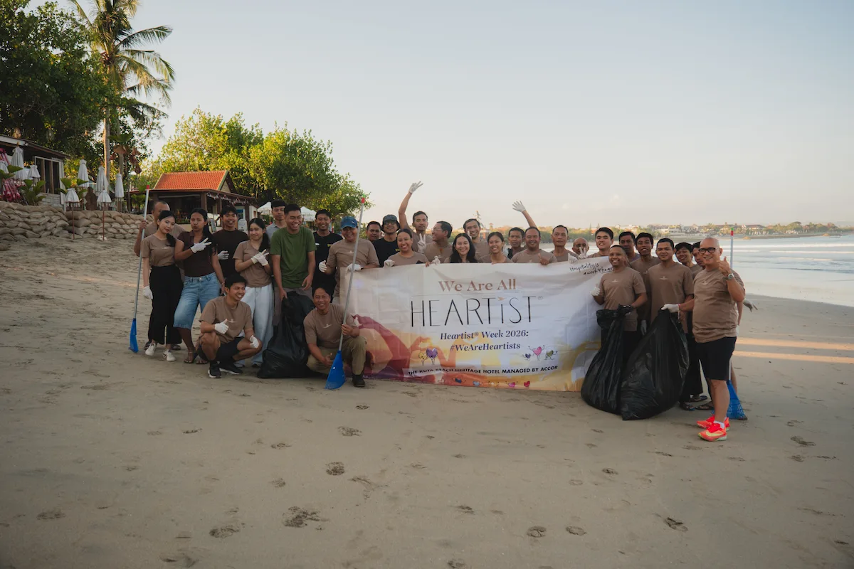 Group of people taking a photo on a beach
