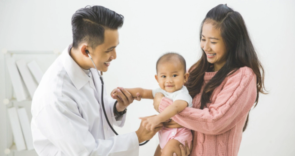 mother with her child and a doctor