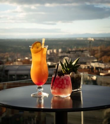 Vibrant cocktails on a rooftop terrace