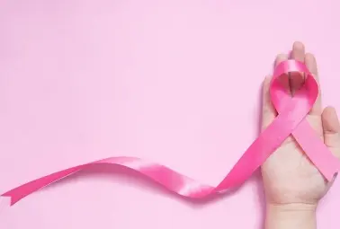 pink ribbon and hand