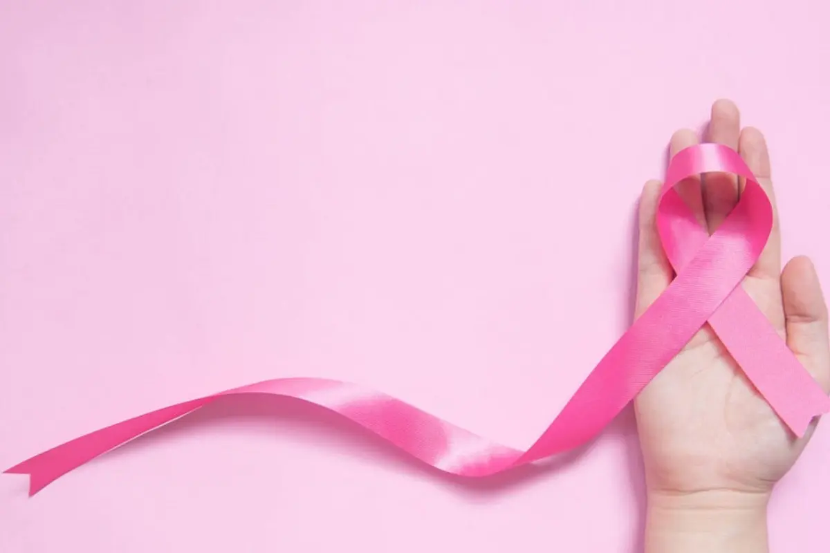pink october ribbon and hand