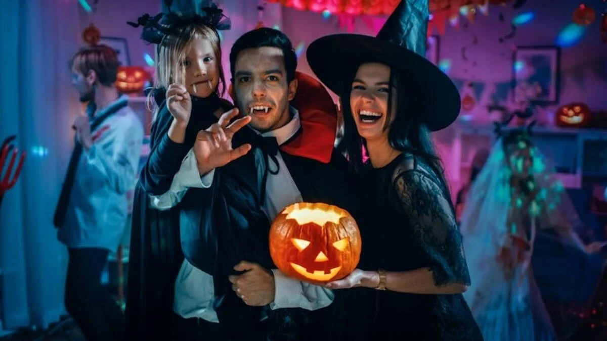 family wearing different costumes celebrating halloween