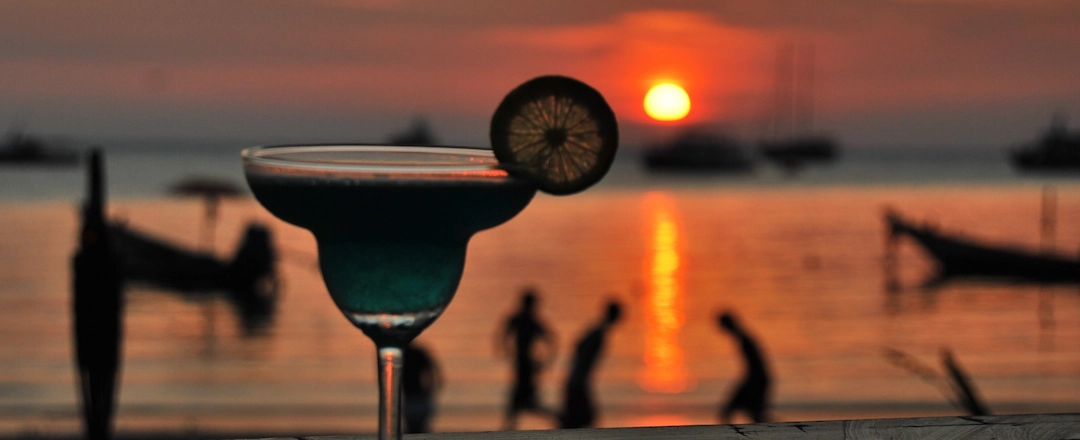 Cocktail with Scenic Sunset on the Background
