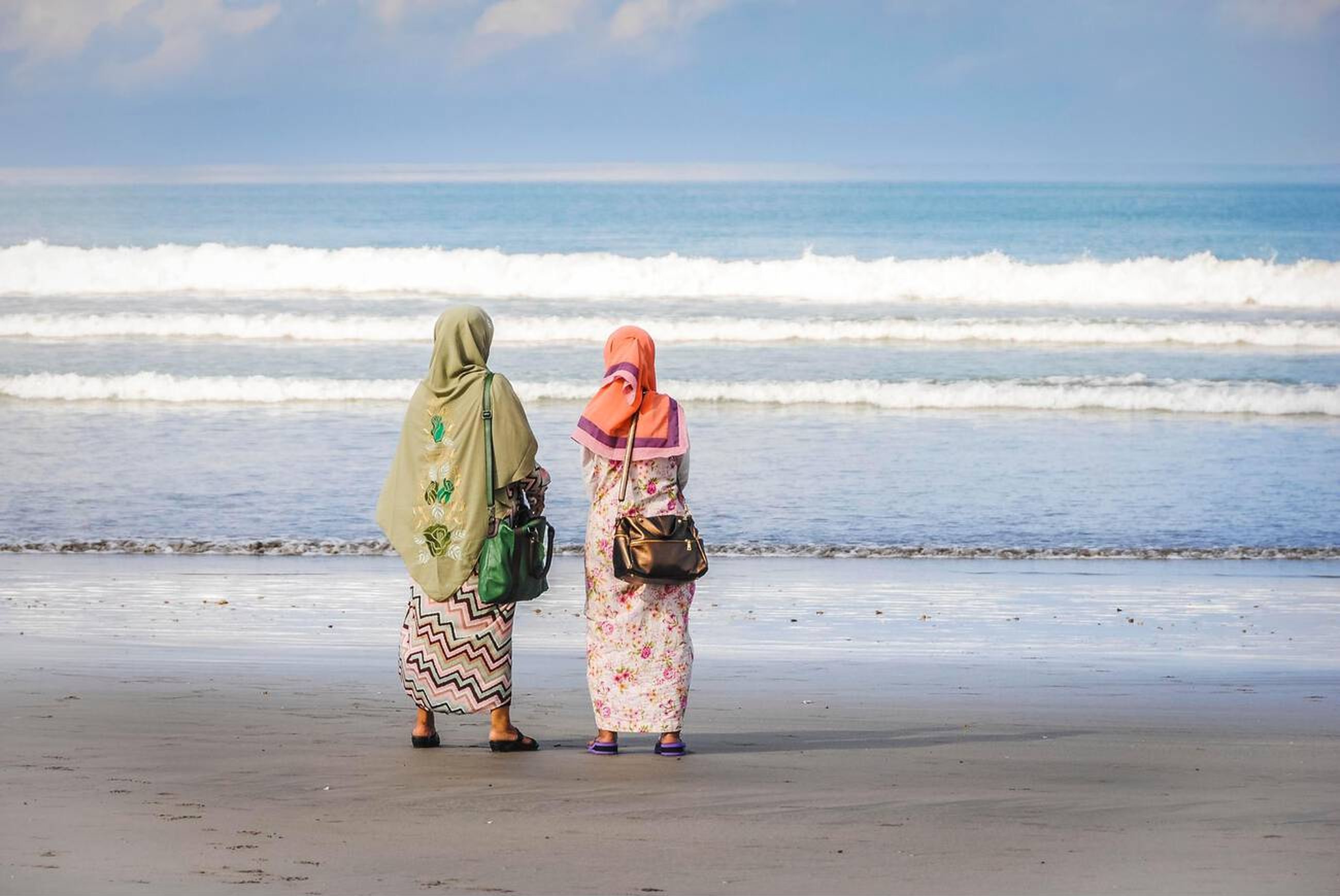 A Brief History of Islam in Bali - Two muslim women on the Beach in Bali