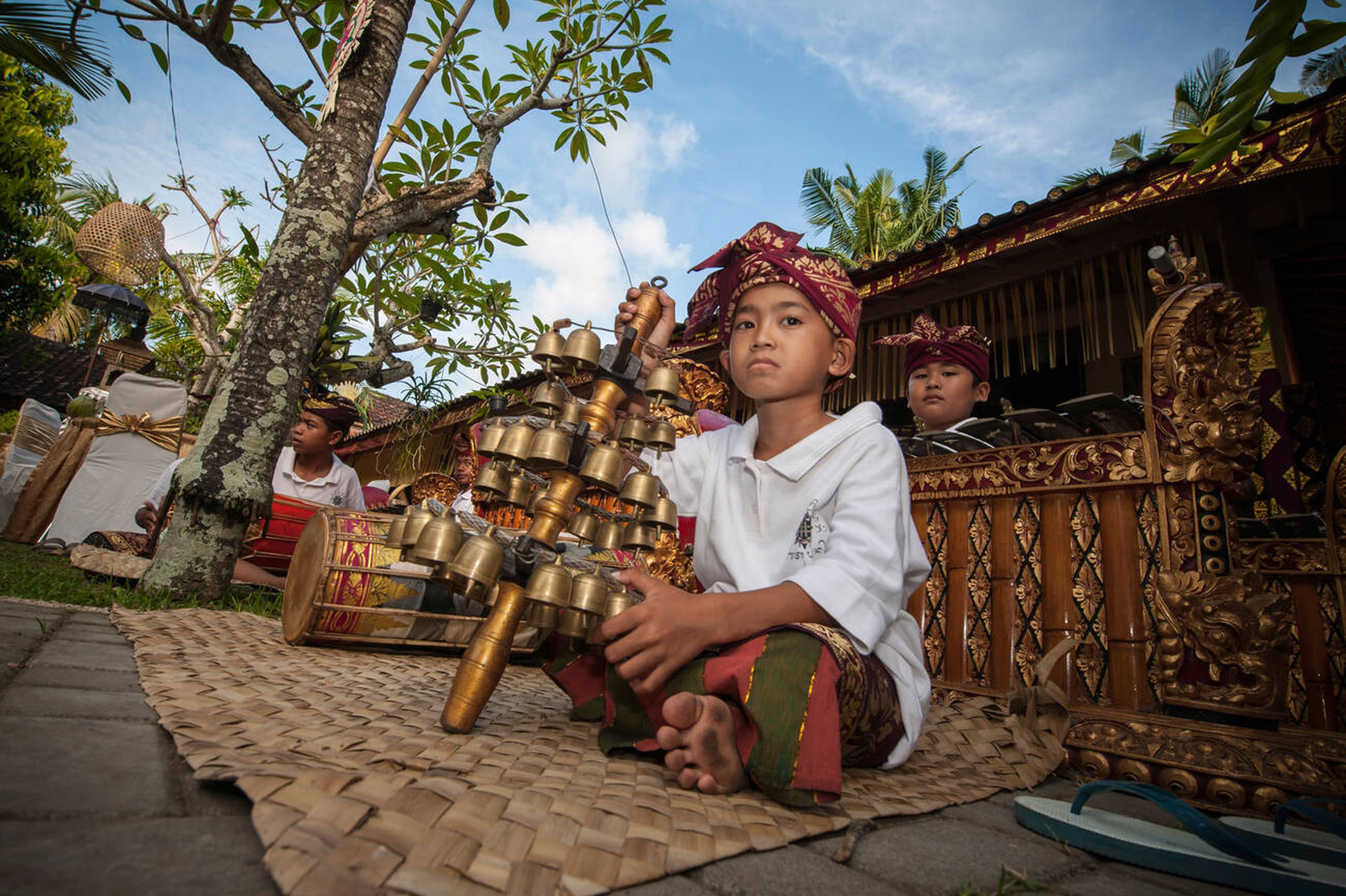 Balinese Kid Play Gamelan Orchestra