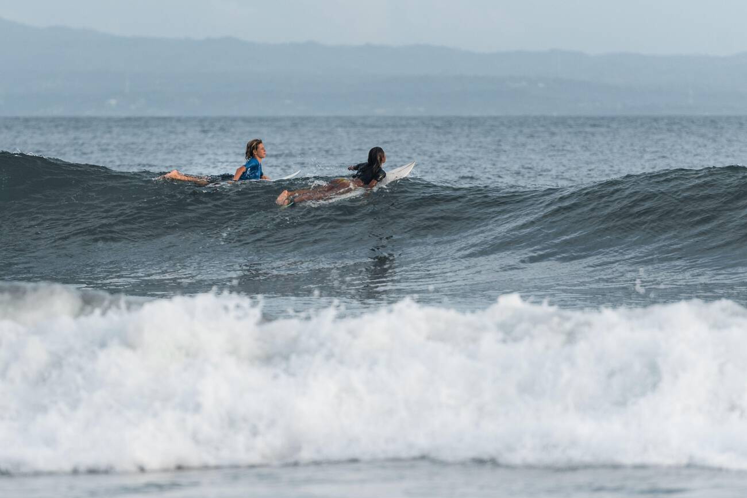 Gianyar Bali’s Next Surfing Hotspot - Man and Woman Surfing at Keramas