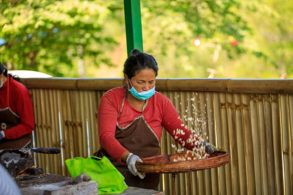 Lady in Muntigunung Processing Cashew by Muntigunung